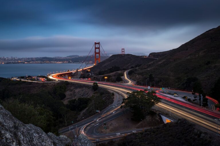 Golden Gate Bridge at dusk from the Marin Headlands, with light trails on Highway 101 heading into Marin County